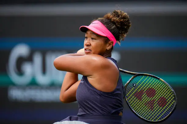 'S-HERTOGENBOSCH, NETHERLANDS - JUNE 11: Naomi Osaka of Japan plays a plays a plays a backhand in her women's singles first round match against Elise Mertens of Belgium on Day 2 of the Libema Open Grass Court Championships at the Autotron on June 11, 2024 in 's-Hertogenbosch, Netherlands (Photo by Rene Nijhuis/BSR Agency/Getty Images)